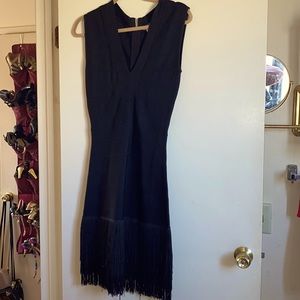 Slinky fringed black cocktail dress.
